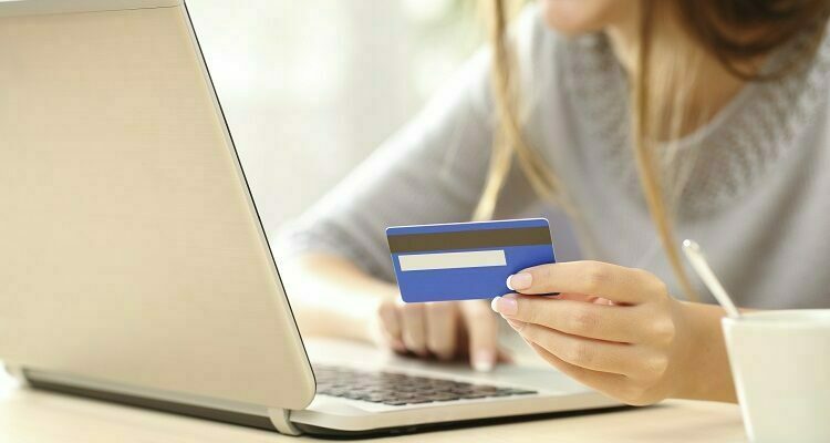 Woman buying online with credit card